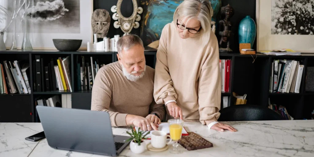 elderly couple calculating retirement income
